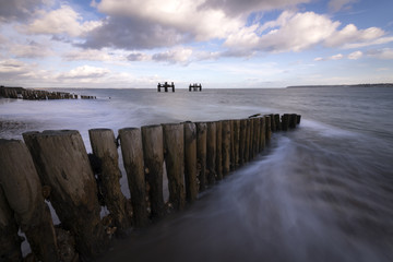 The wooden groynes and dolphin structures at Lepe in Hampshire.