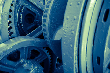 Close up of mechanical heavy metal wheel cog.