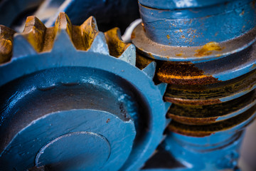 Close up of mechanical heavy metal wheel cog.