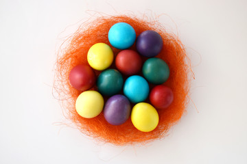 Fototapeta na wymiar Colorful Easter eggs on white background. Top view.
