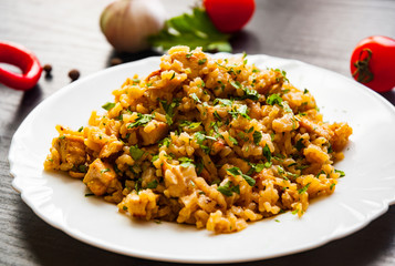 Chicken Breast with Rice on a dark wooden background