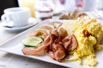 Breakfast with ham and egg on table