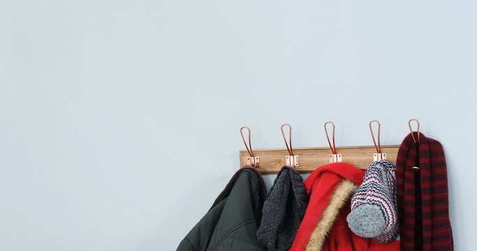 Warm clothes hanging on hook 
