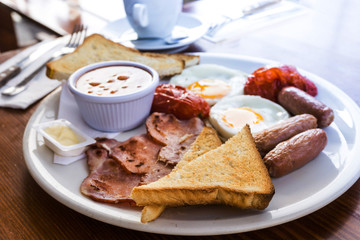 classical english breakfast with egg and fries