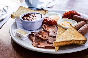 classical english breakfast with egg and fries