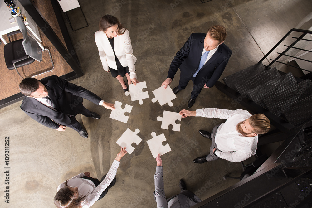 Poster teamwork of partners. concept of integration and startup with puzzle pieces