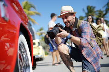 Fototapeta premium Photographer taking picture of old fashioned pick-up