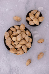 Two bowl with almonds nuts