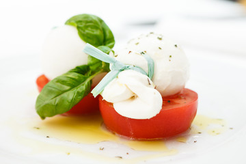 Mozarella cheese with tomatoes