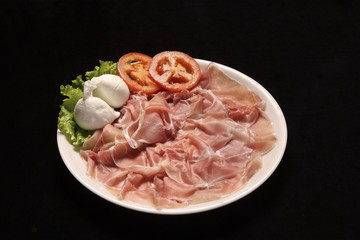 raw parma ham with mozzarella