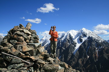 Young woman at top of mountain, Altai, Russia