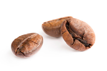 Brown coffee beans isolated on white background