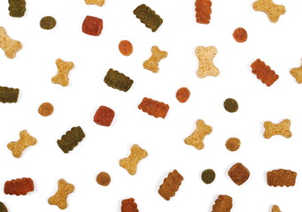 Dry colorful dog food isolated on white background, top view