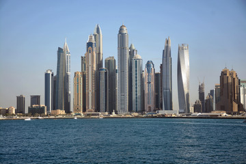 Fototapeta na wymiar City's skyscrapers from seaside
