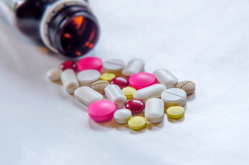 Close-up of the pills on the white background, The drug and capsule pills on the floor, Pile of the...
