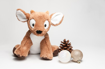 Christmas Tree Ornaments on a Isolated White Background with a stuffed toy deer