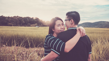 Asian,Romantic couple or Homosexuality, female love hug on the rice field with sunset, Valentine's Day love concept