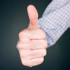 Like and approve hand gesture with thumb up