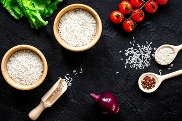 ingredients for paella on dark background top view