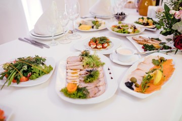 Vegetable and cold cuts platter on the table