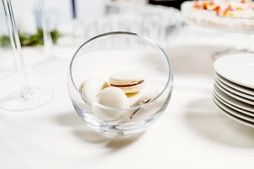 Fototapeta na wymiar Wedding reception dessert table with delicious decorated white c