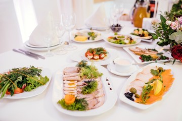 Vegetable and cold cuts platter on the table