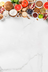 Set of organic healthy diet food, superfoods - beans, legumes, nuts, seeds, greens, fruit and vegetables.. white background copy space. top view