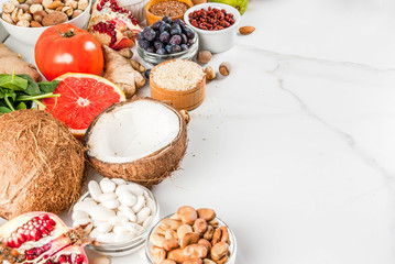 Set of organic healthy diet food, superfoods - beans, legumes, nuts, seeds, greens, fruit and vegetables.. white background copy space