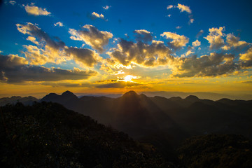 Silhouette sunset on the top of mountain with coulorful sky cloud