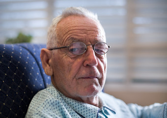 Fototapeta premium Portrait of old man on sofa