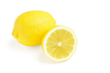 One whole and half of yellow ripe lemon fruit, isolated on a white background