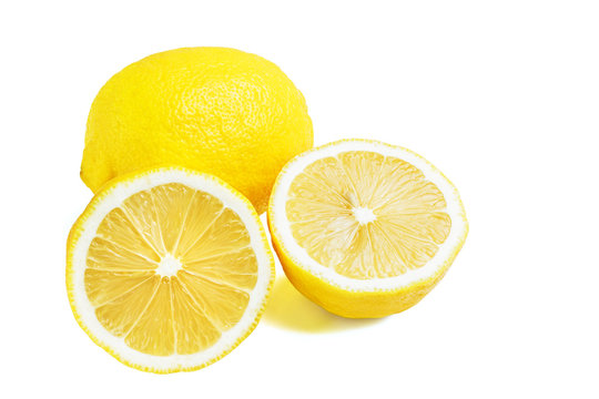 One whole and two halves of yellow ripe lemon fruit, isolated on a white background