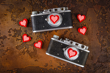 Two retro camera and hearts