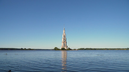 Fototapeta na wymiar Ancient Christian church located on an island in the middle of the lake. Aerial view Old monastery.