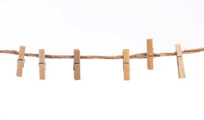 Clothespins with the rope on a white background