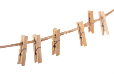 Clothespins with the rope on a white background