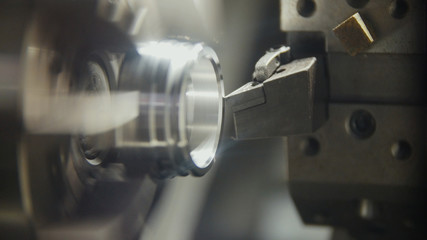 Replacing and placing the metal parts in the lathe for machining
