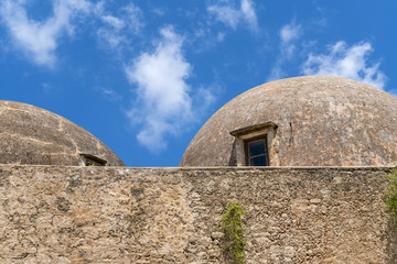 Fototapeta na wymiar old weathered domes of an old greek castle