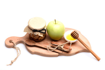Rustic kitchen composition. Apples, nuts and honey isolated on white