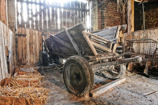 Old wooden waggon standing in an old barn