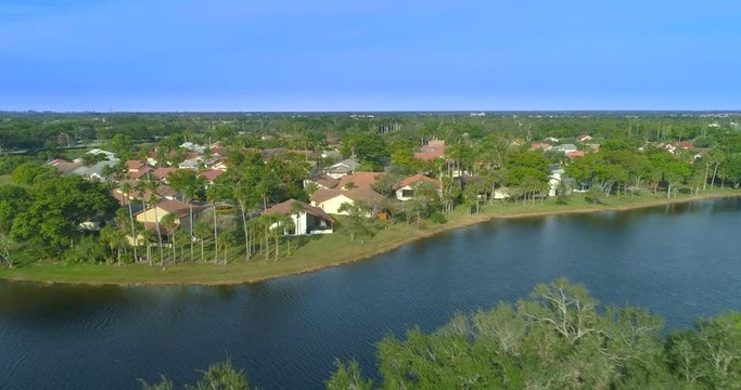Low aerial flyover homes in Weston Florida residential neighborhood 4k