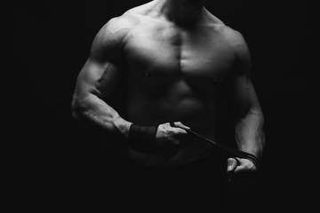 Strong athletic man showes naked muscular body