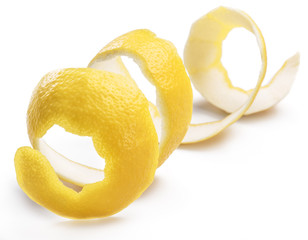 Lemon peel or lemon twist on white background. Close-up.