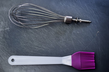 Whisk for cooking food and cooking for women. Women's work in th