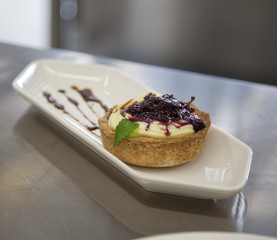 small dessert tart with cream and marmellade