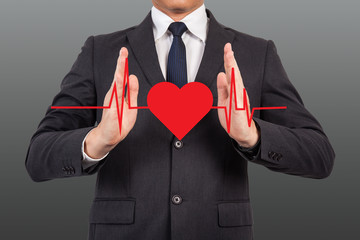 Doctor with heart pulse graphic.