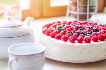 Home mousse cake with cottage cheese and jello with raspberries and blackberries. The concept of proper nutrition, weight loss, health holidays