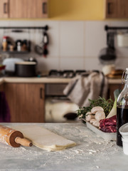 Table with Dough and Blurred Kitchen