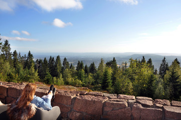 Fantastic view on the top of a mountain in Norway. Blue sky and small white clouds makes the feeling great.