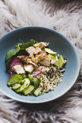 Healthy Quinoa Bulgur bowl with vegetables and chicken